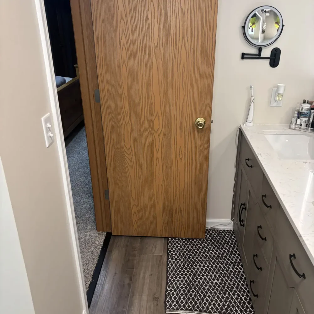 Newly Refinished Bathroom with Light Oak Doors and Custom Cabinetry